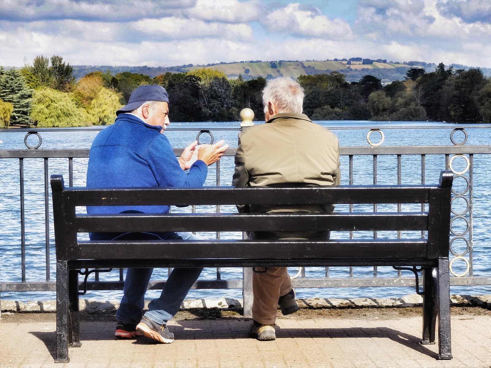 Older couple in front of their home